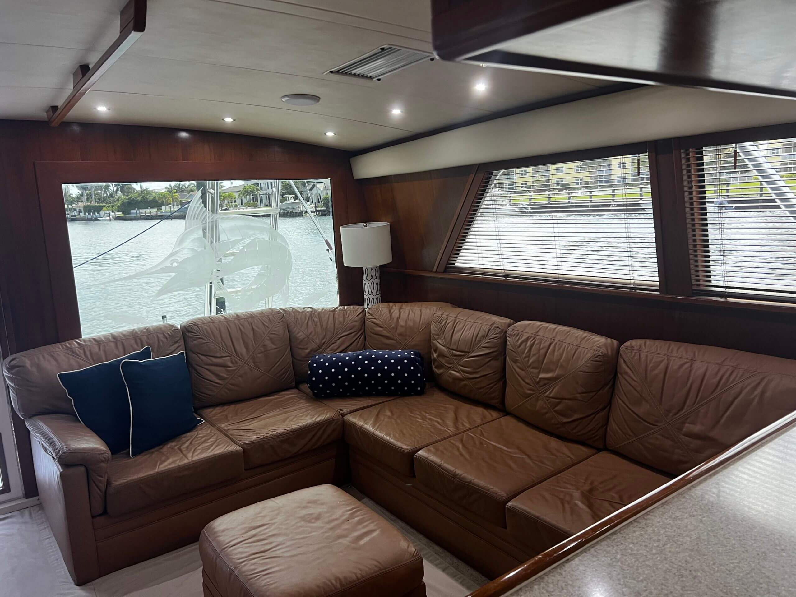 Brown leather sectional in yacht cabin.