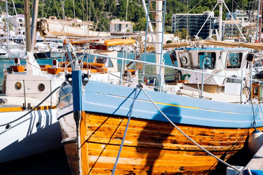 Wooden boat moored at sunny marina