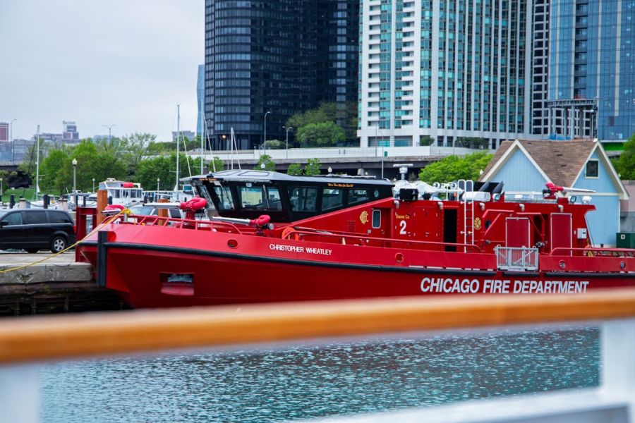 Red Chicago Fire Department fire boat on water.