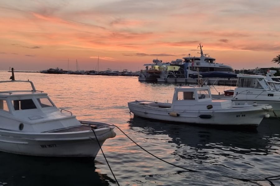 Sunset harbor with moored boats
