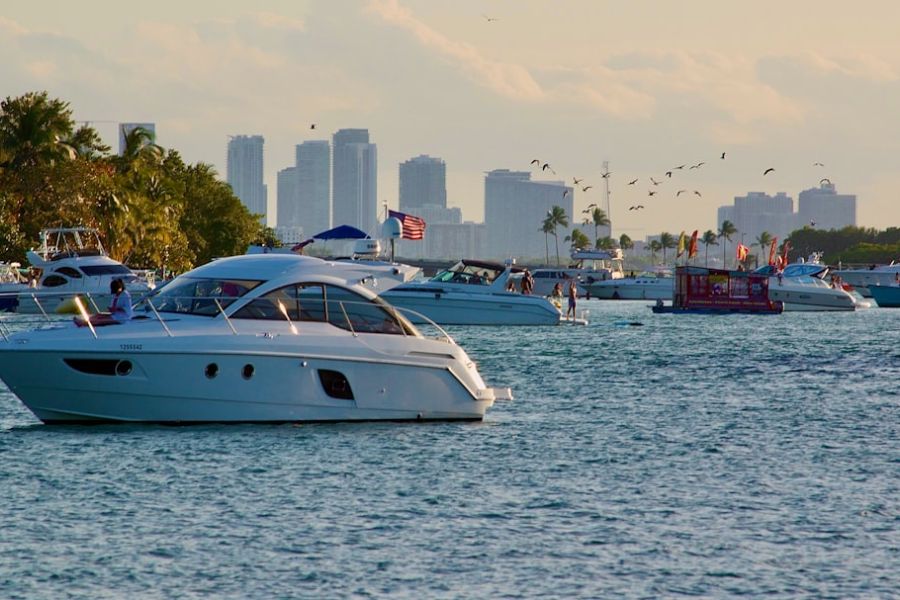 Yacht on calm water with city skyline