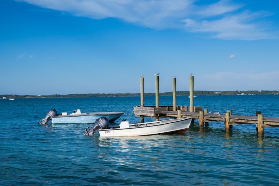 Boats moored at a wooden pier
