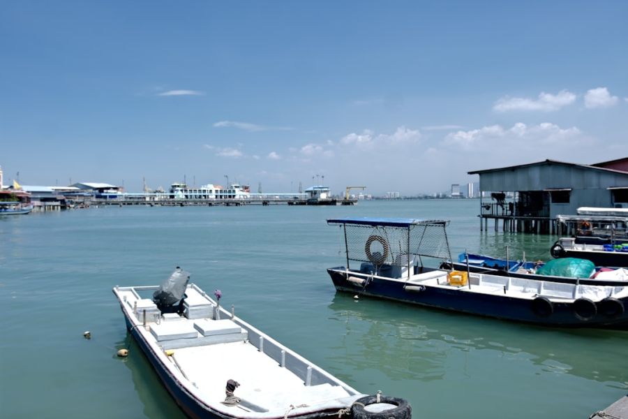 Boats docked along a calm harbor