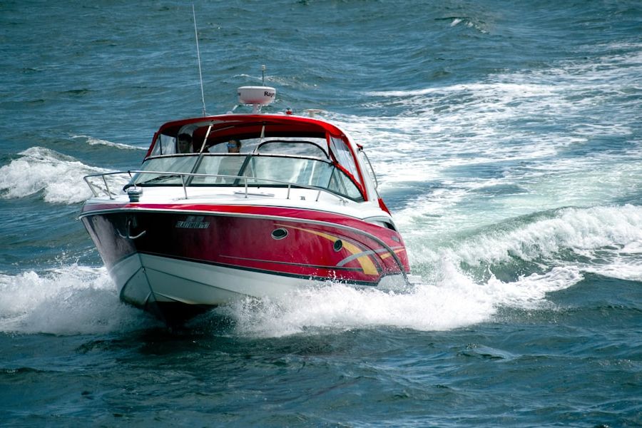 Red speedboat cruising through waves