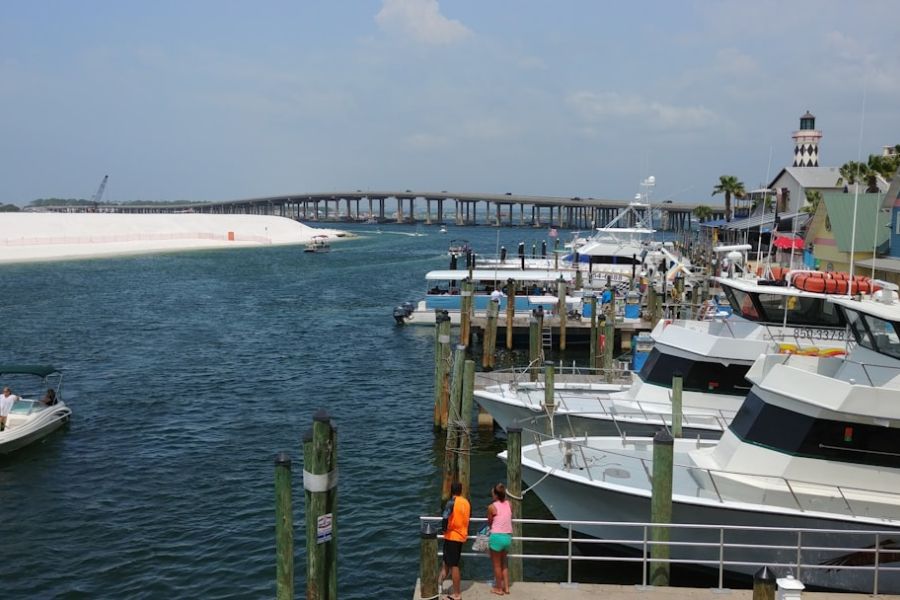 Marina with moored yachts and colorful buildings