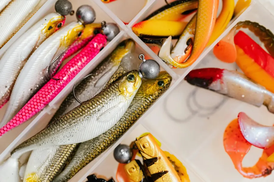 Assorted fishing lures in a tackle box