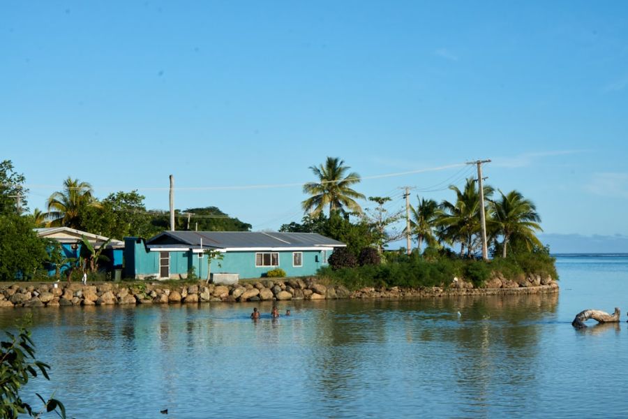 Tropical waterfront village with turquoise houses