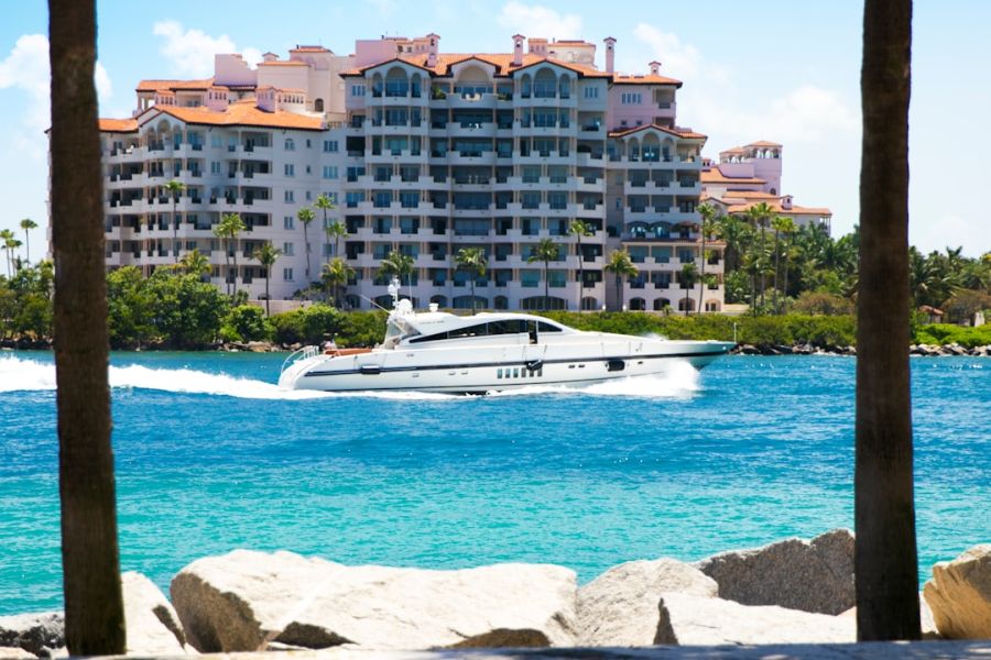White luxury yacht on turquoise sea near resort