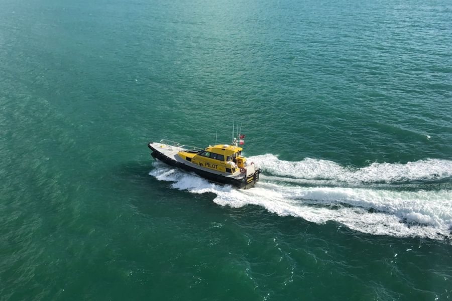 Yellow pilot boat on turquoise sea