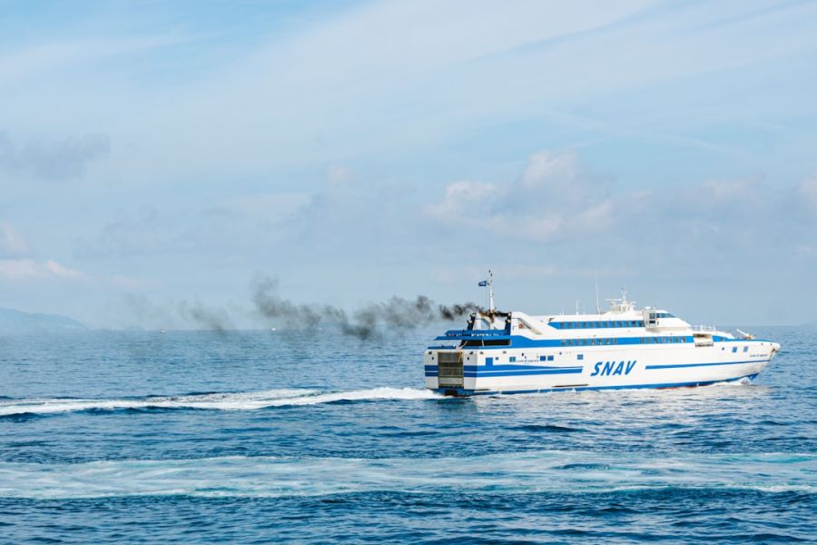 White and blue SNAV ferry at sea