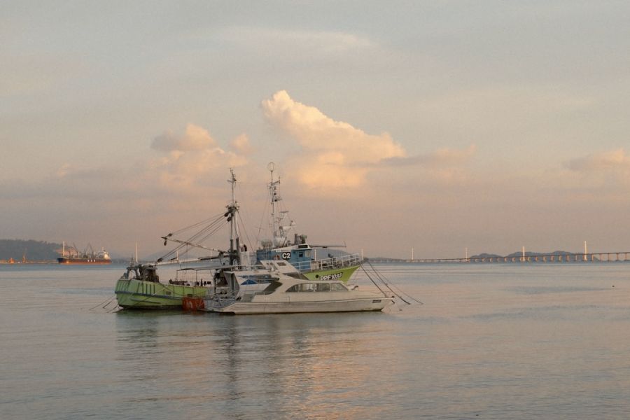 Two fishing boats anchored on calm water