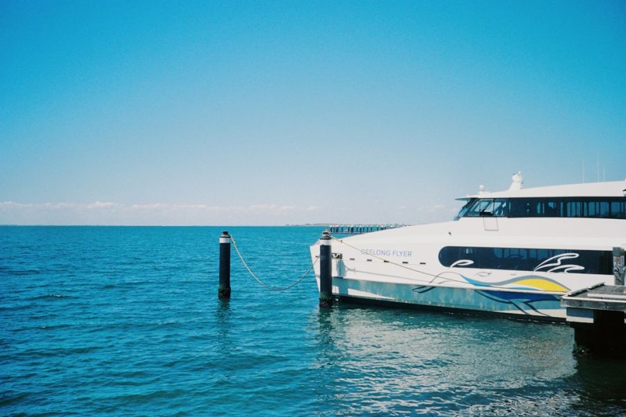 White ferry moored at blue sea.