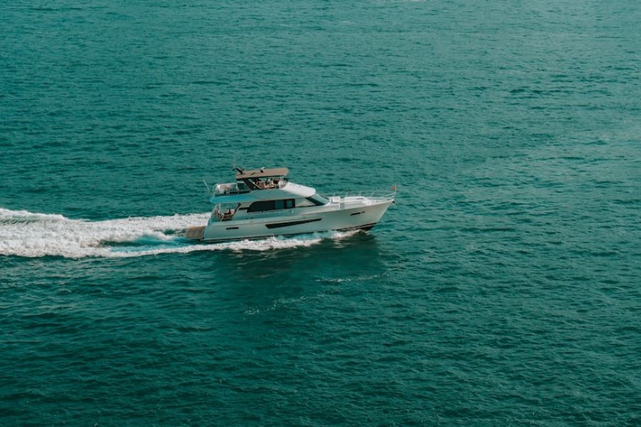 White yacht cruising on turquoise sea