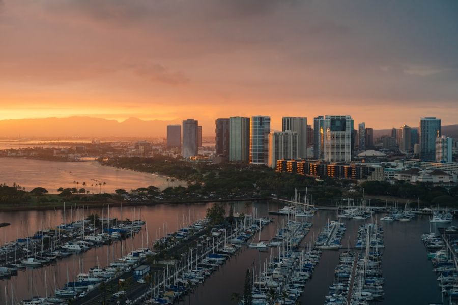 Sunset over marina and city skyline