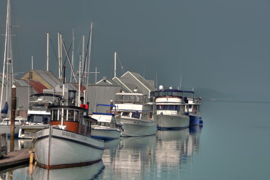 Row of moored boats at calm harbor