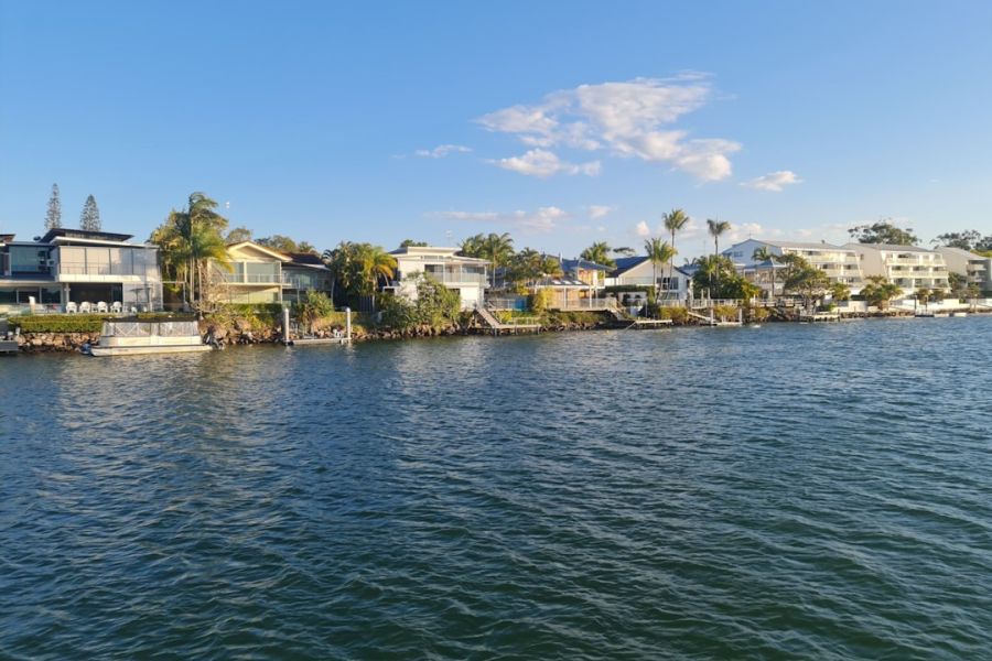 Waterfront homes along a calm river.