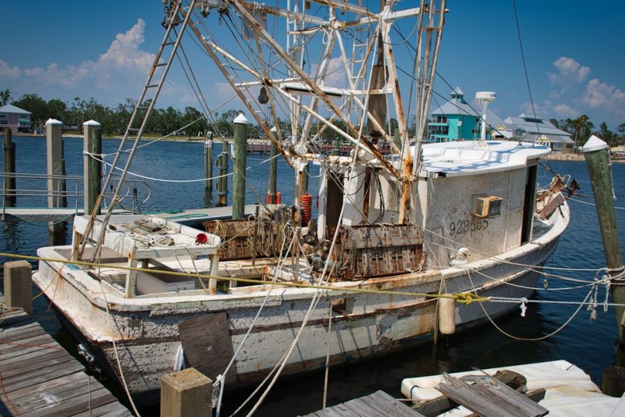 Rusty fishing boat tied to the dock.