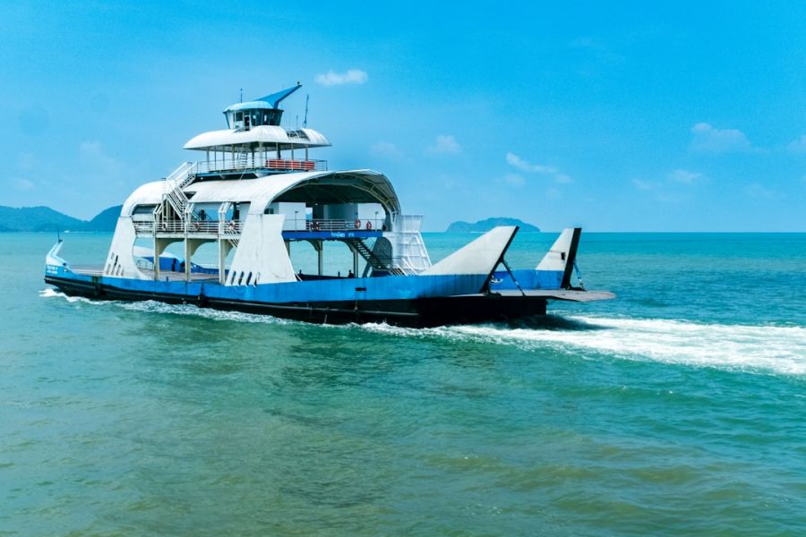 Blue ferry boat on turquoise sea