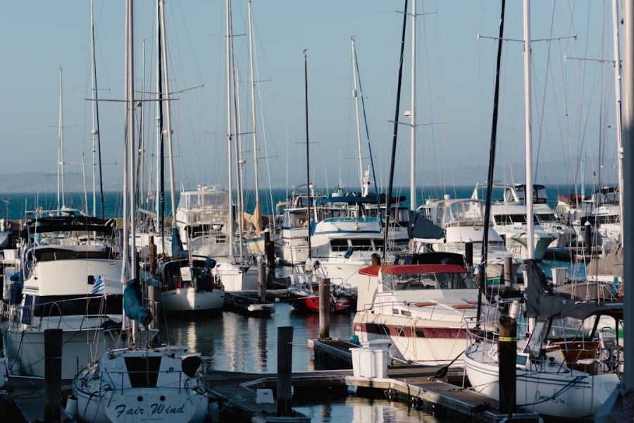 Sailboats and yachts docked at marina